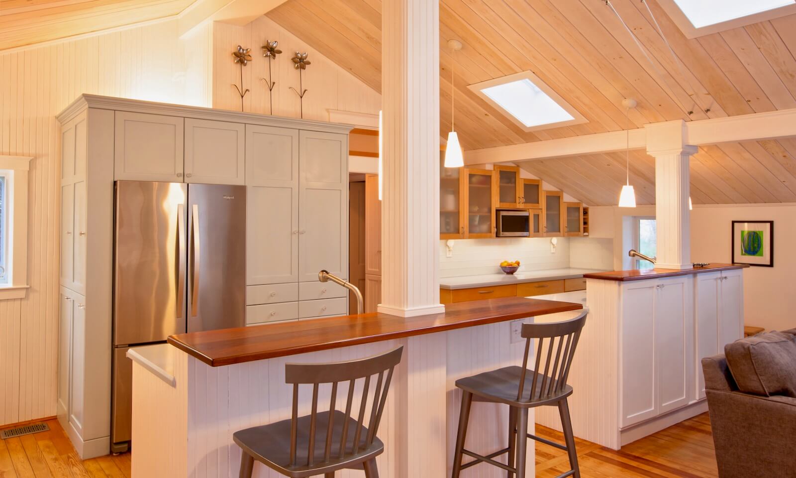 Modernist kitchen renovation with vaulted ceiling and custom cabinets by Duxbury MA design/build