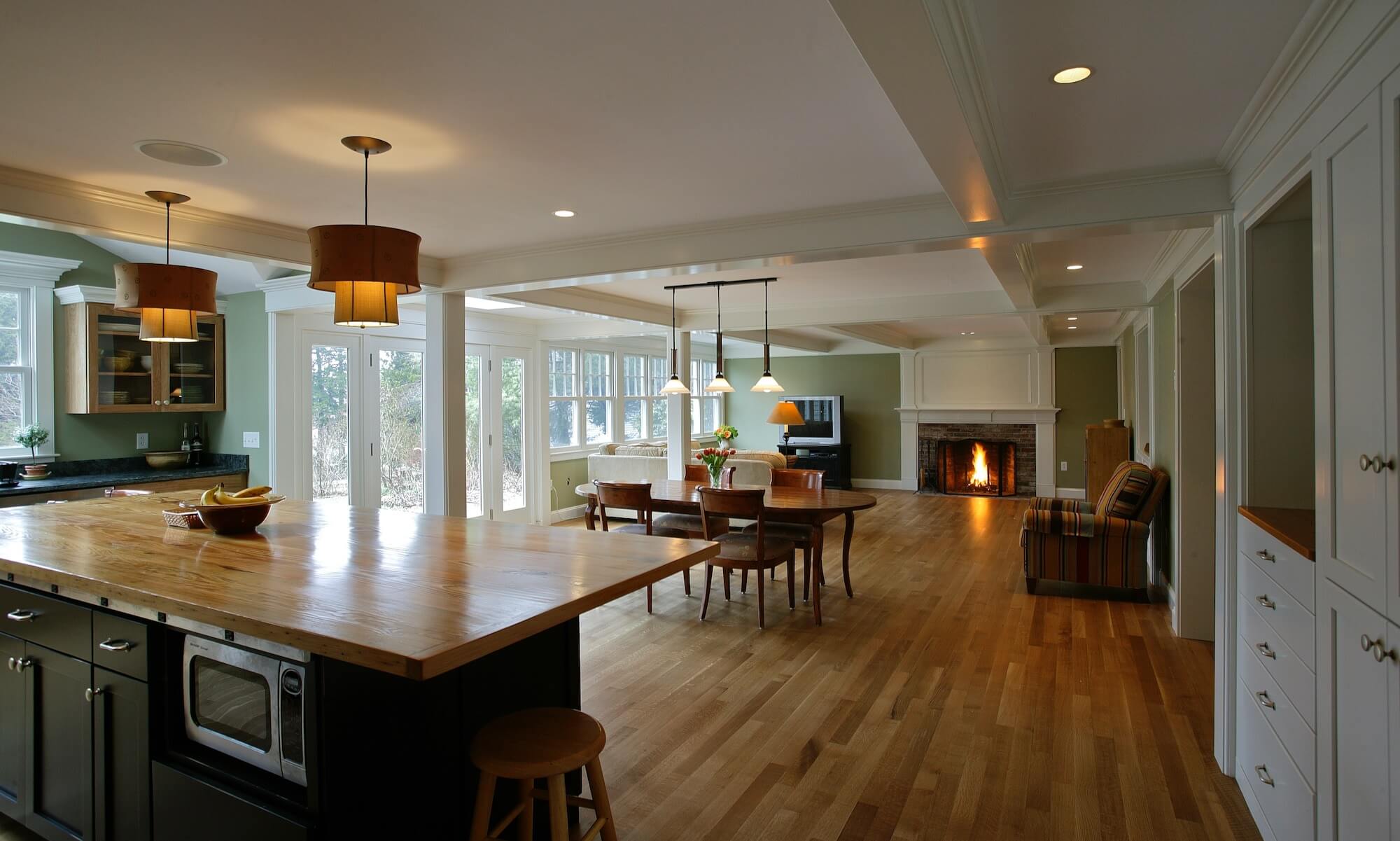 Kitchen and living room addition with box beam ceiling in Scituate MA. Featured in Fine Homebuilding Magazine.