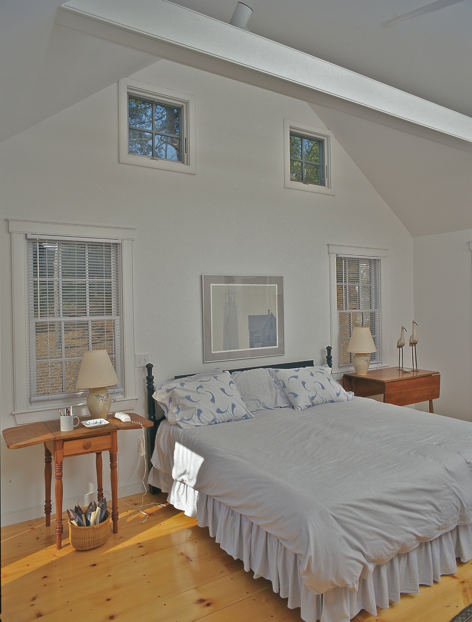 Vaulted ceiling master bedroom, awning windows at gable end, traditional Cape Cod house plan