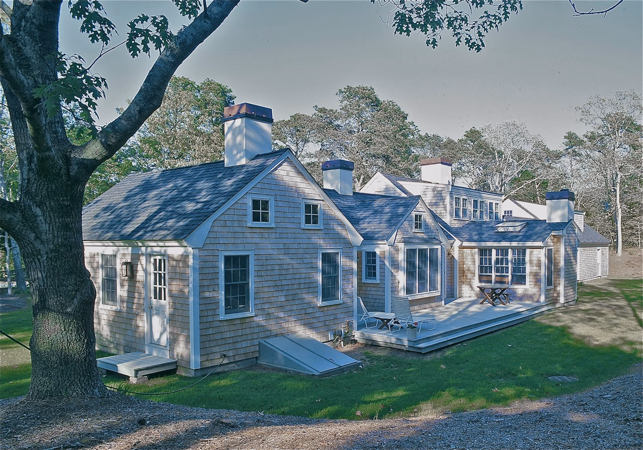 Exterior gables, awning windows, “Tory Stripe” chimney, Cape Cod House, chatham MA
