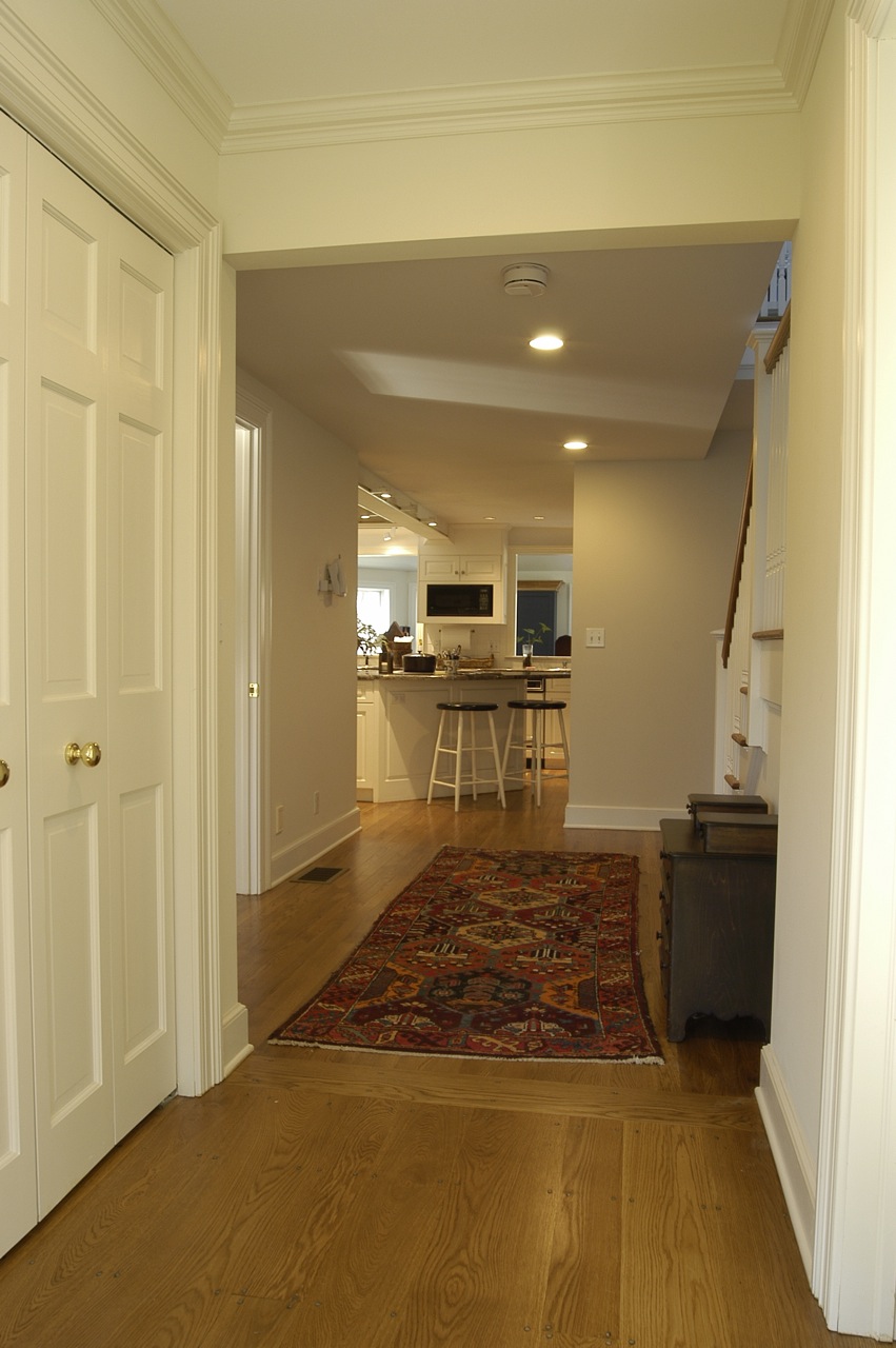 Interior hallway leads to skylit kitchen in new Canaan CT home design