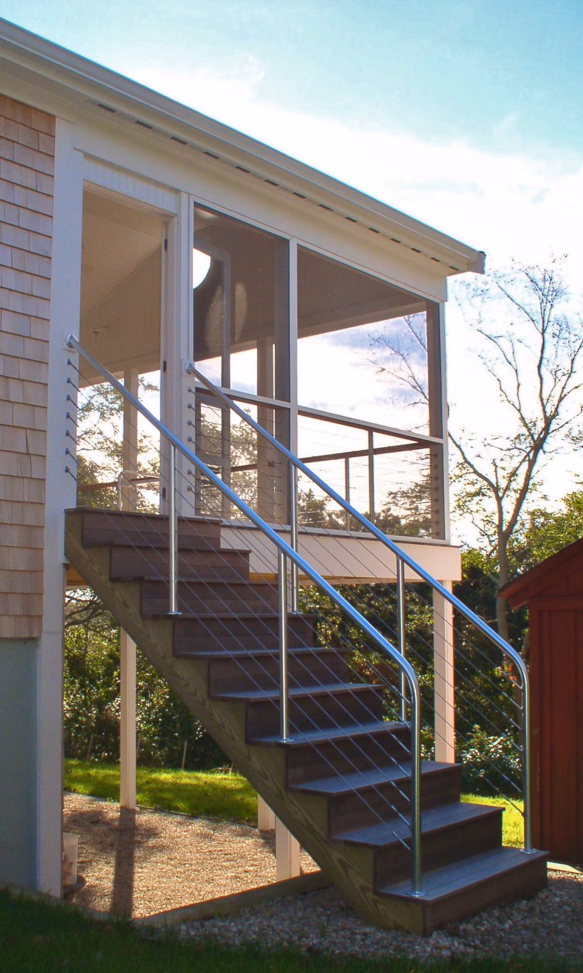 Stair with cable rails by Duxbury design/build firm