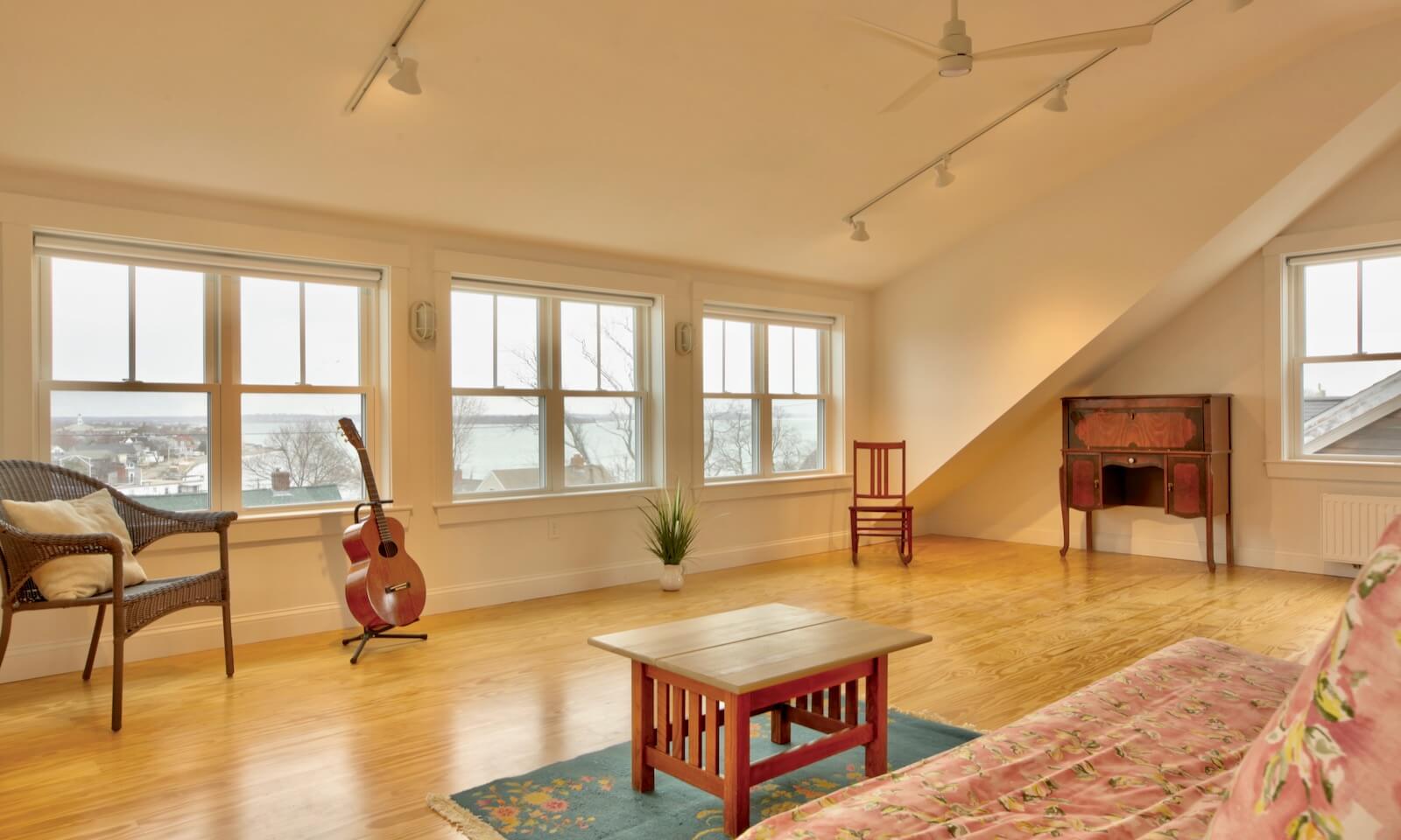 top floor living room with ocean and bay views in new custom coastal home in Hull Ma by duxbury MA design/build firm