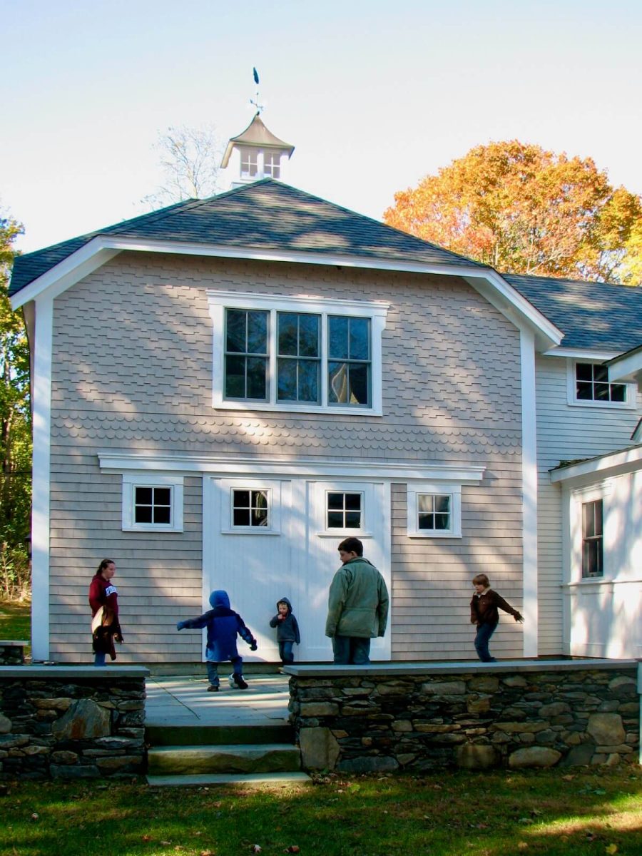 Shingled barn addition to historic coastal home by Duxbury architect and builder